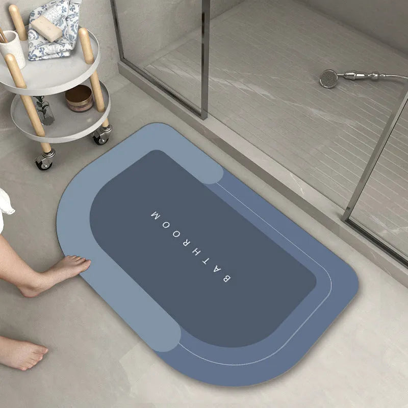 Blended material floor mat in blue colour with oval shape on bathroom floor