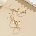 Geometric spiral design gold electroplated alloy earrings with elliptical shape