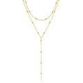 Fashion long necklace with geometric tassel and round beads in gold colour on clavicle chain
