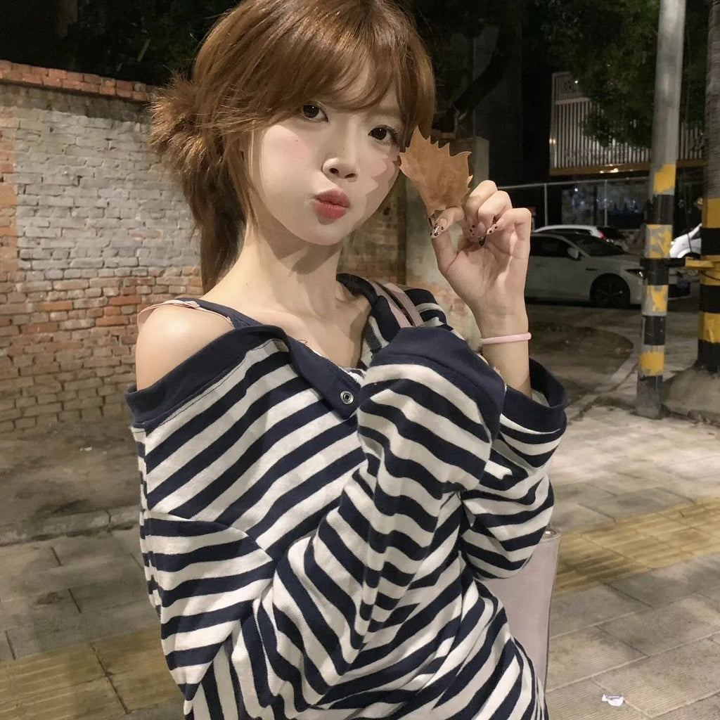 Dark blue oversized women's long-sleeved t-shirt with Korean-style embroidery and button details.