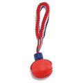 Blue natural rubber dog ball with rope toy showing textured surface, sized for medium and small dog breeds