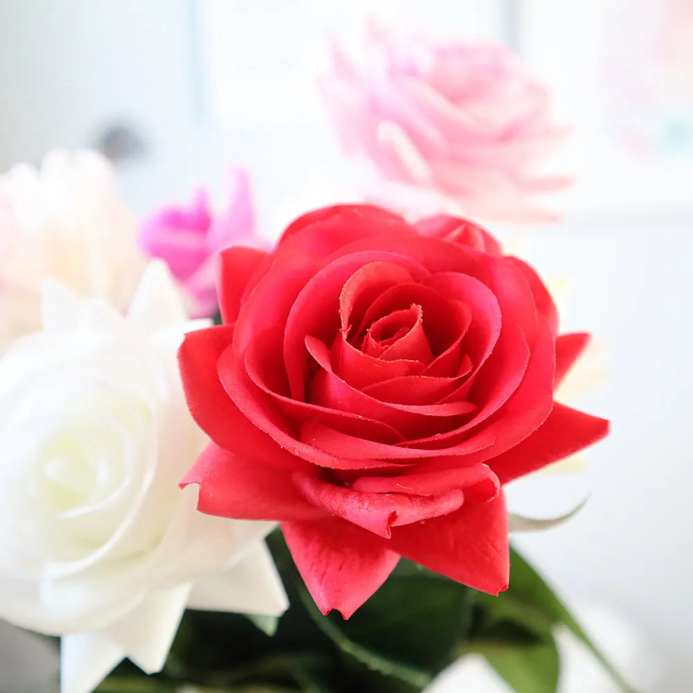 Silk artificial rose flower in red, 42cm long with 8.5cm fabric flower head on plastic stem.