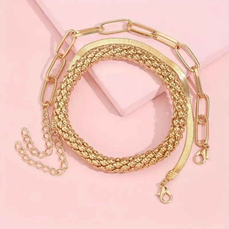 Set of three alloy snake bone chain bracelets in retro geometric design with electroplated gold finish