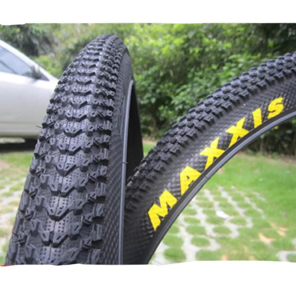 Ultralight mountain bike tyre with knobbly tread, shown in multiple size options including 26, 27.5 and 29 inch.