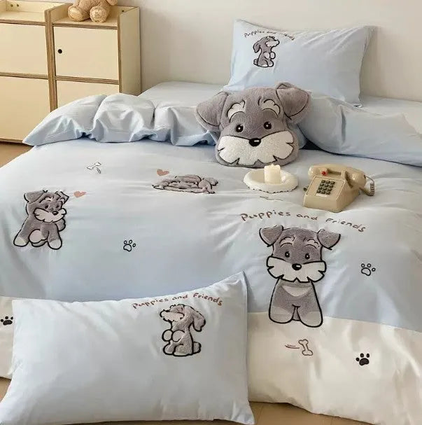 Cartoon Schnauzer embroidered bedding set with flat sheet and matching pillow on bed