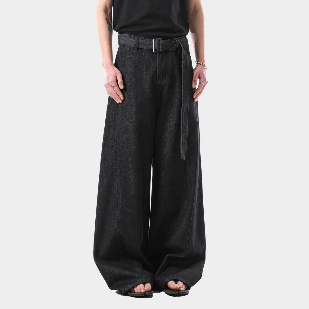 Black high waist straight-leg jeans with gold stitching on a mannequin
