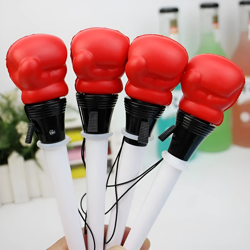 Set of four pressure relief pens with boxing press ejection mechanism and black 0.7mm refills