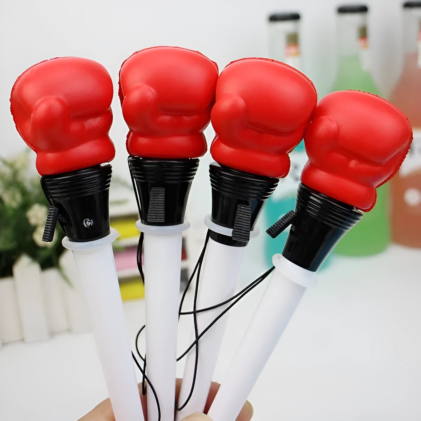 Set of four pressure relief pens with boxing press ejection mechanism and black 0.7mm refills