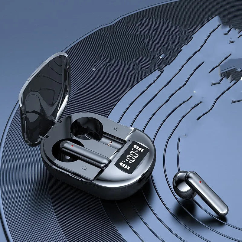 Black and white wireless Bluetooth in-ear headphones with a charging case on a plain background.
