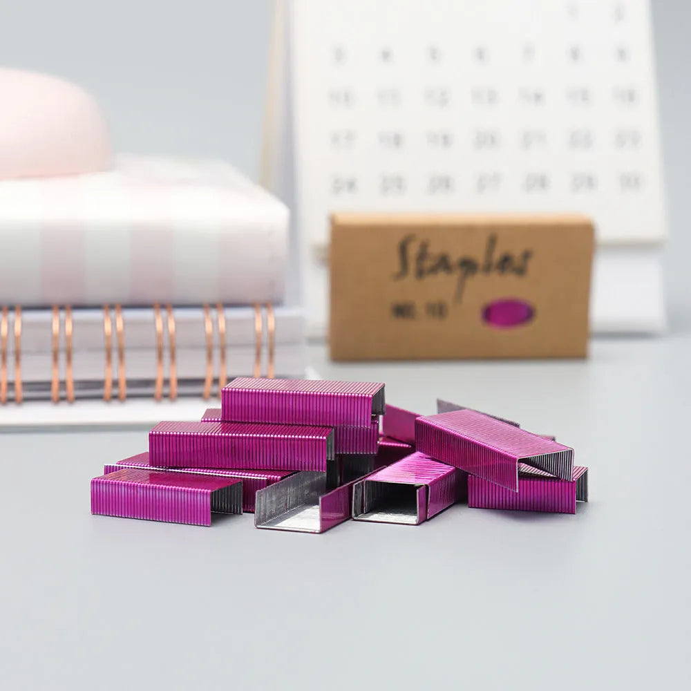 A box of 1000 metal office staples in colours black, purple, rose gold, and rose red.