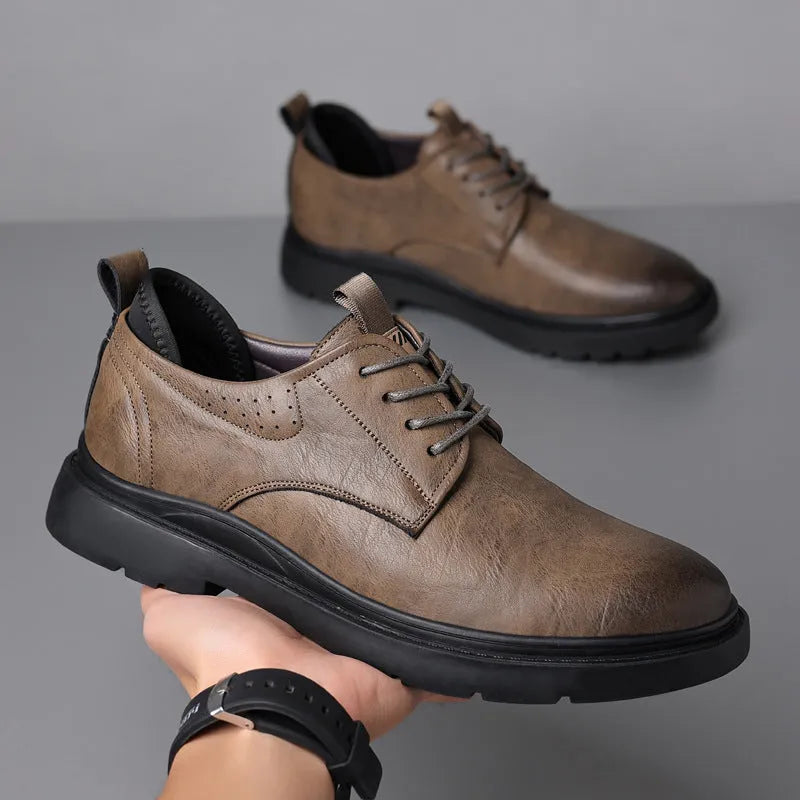 Men's black leather shoes with visible stitching on a two-layer cowhide upper and a rubber sole.