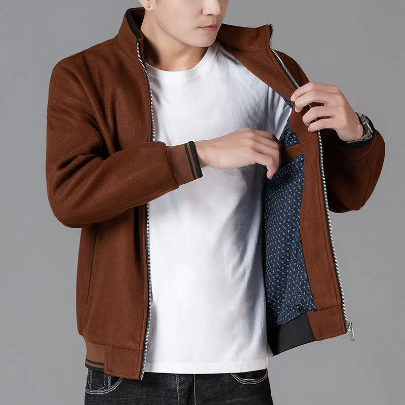 Men's grey sports-style fleece jacket with long sleeves and a stick pocket on the chest.