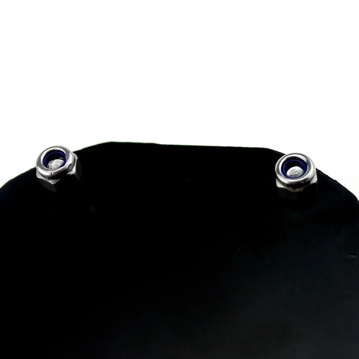 Black carbon fibre pattern motorcycle tax seal with six-corner anti-theft screw, metal alloy construction