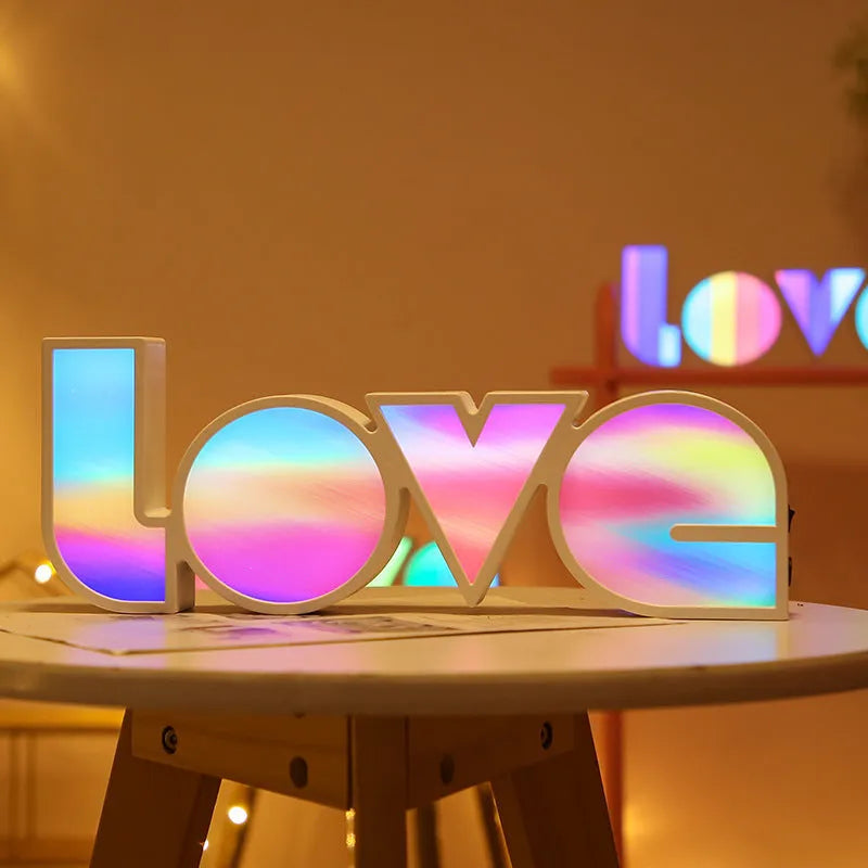 Colourful rainbow LED decorative light spelling LOVE, with USB cable, for Valentine's Day or wedding decor.