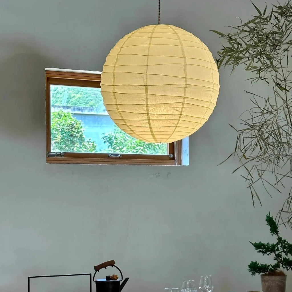 Japanese style rice paper pendant chandelier with soft glowing light.