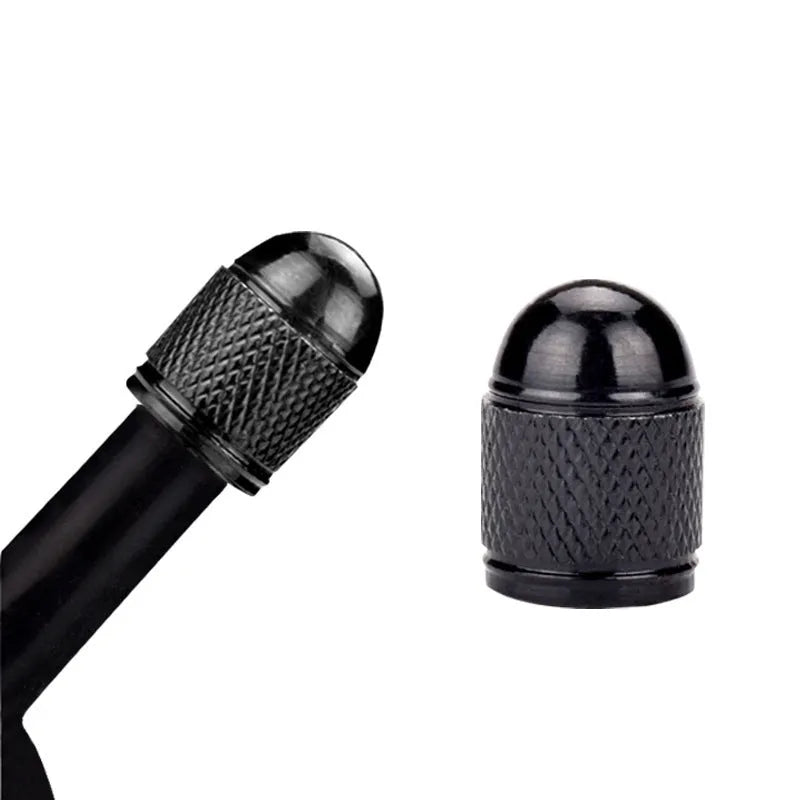 Aluminium mountain bike tyre valve cap in black, blue, gold, red, and silver colours.
