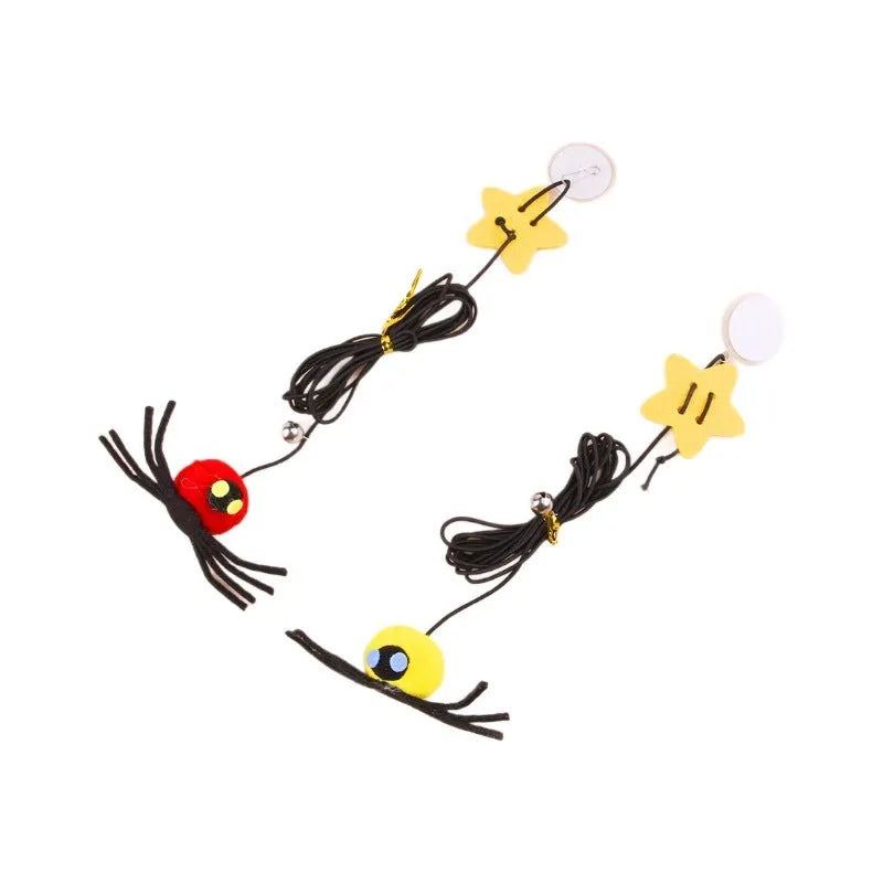 Hanging cat toy with red elastic rope, feather, and bell spider attachment mounted on door