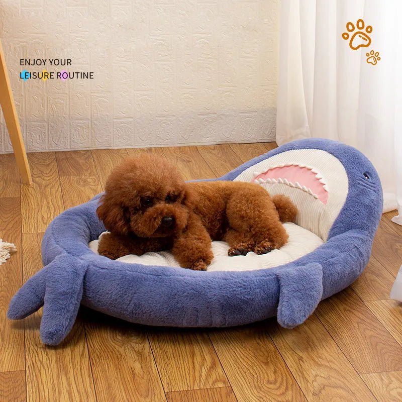 Blue shark pattern velvet pet bed cushion for dogs and cats on a wooden floor.