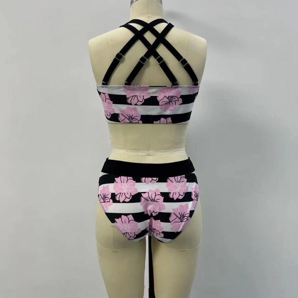 Black women's printed bikini set with belly-covered slimming design for swimming.