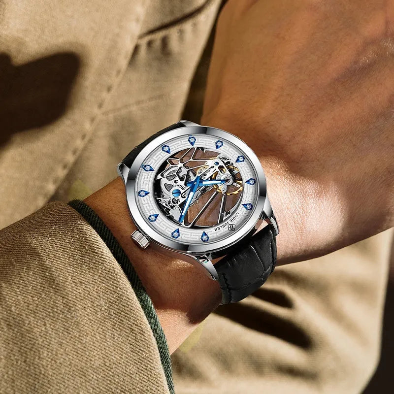 Men's silver mechanical watch with white dial, blue hands, and black leather strap