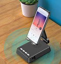 Black mobile phone broadcaster stand with integrated Bluetooth speaker and HD microphone on a desk.