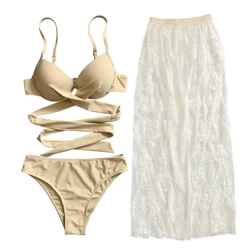 Three-piece backless push-up bikini set in creamy white colour with separate top, panties, and skirt components
