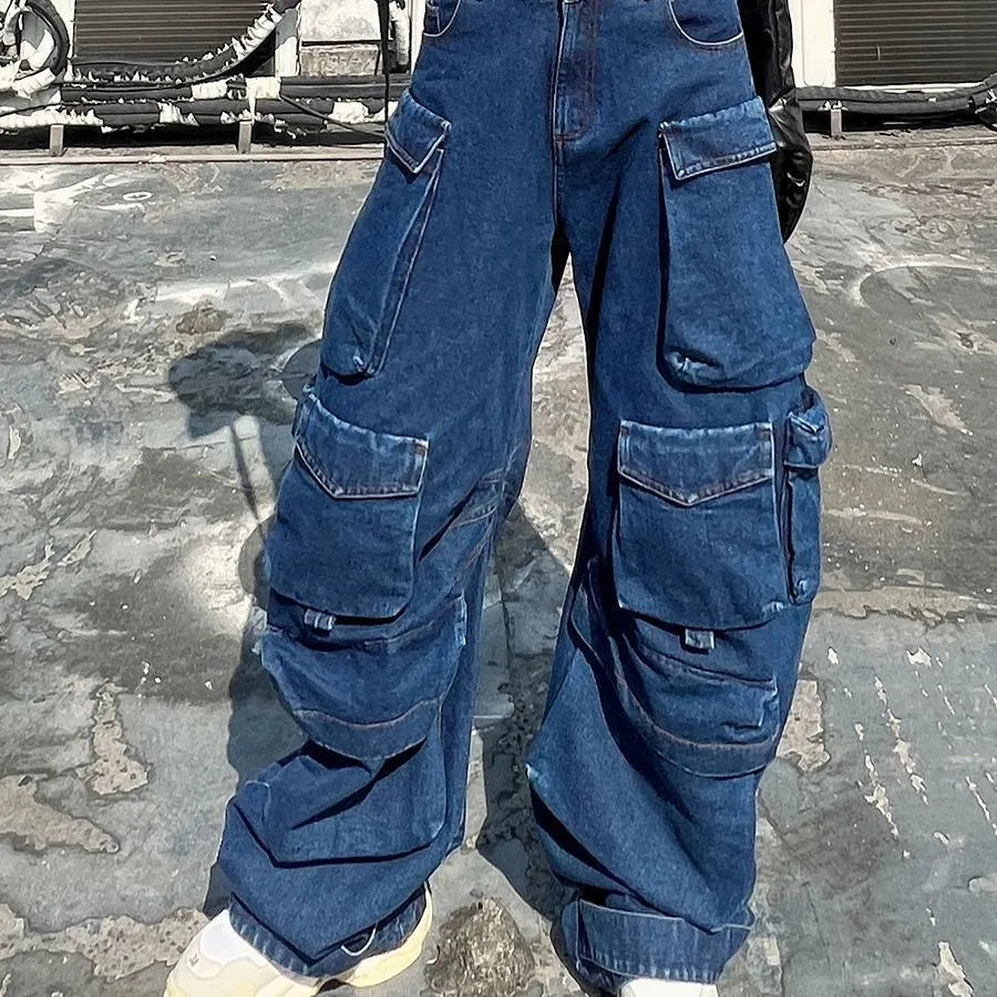 Dark blue distressed wide-leg denim jeans with high waist and multiple pockets laid flat.