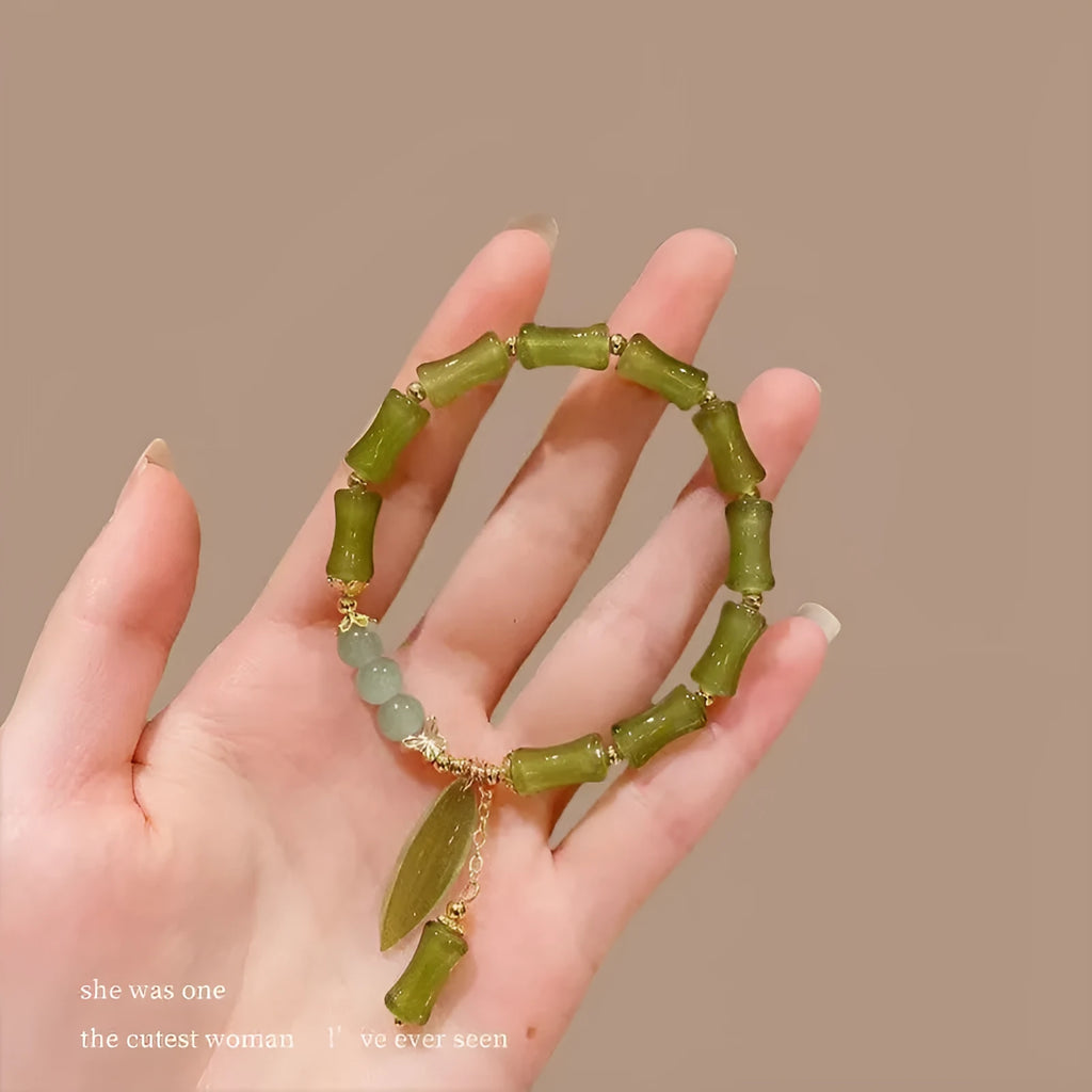 A Chinese style glass bead bracelet for women featuring bamboo joint design elements.