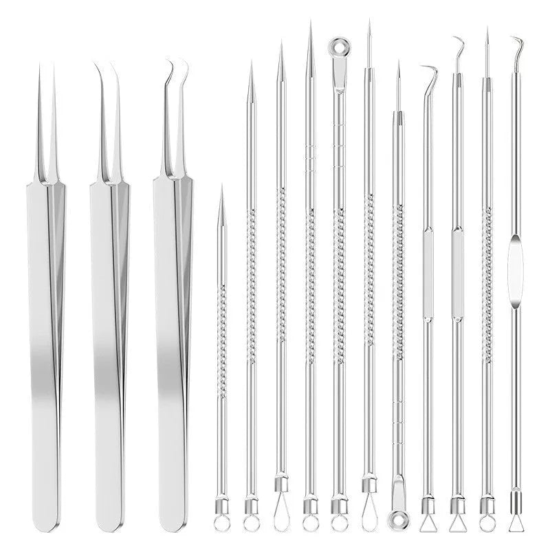Four silver metal acne needles with pointed tips laid out on a surface.