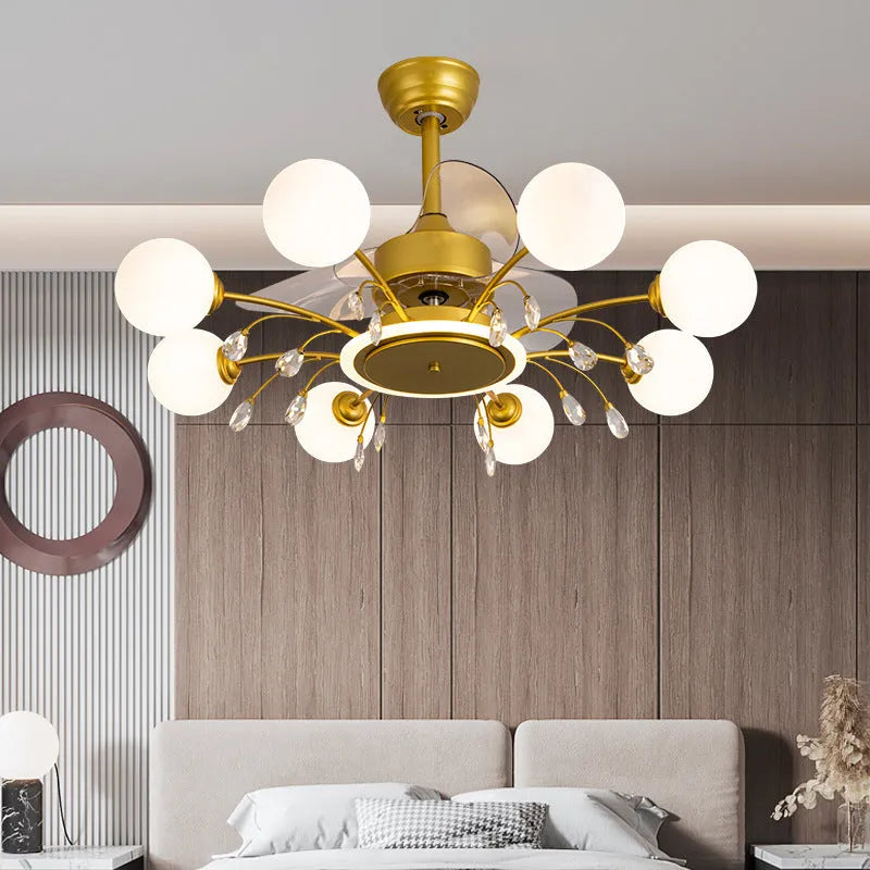 Gold and black ceiling fan lamp with chandelier style lights and metal blades.