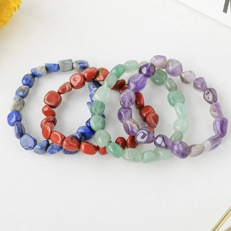 Natural amethyst large particle gravel rolling stone bracelet on a plain background showing smooth rounded beads