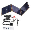 Black foldable 36W solar panel unfolded showing three monocrystalline silicon cells with car charger and USB accessories