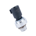 Silver metal automobile fuel pressure sensor on a plain background