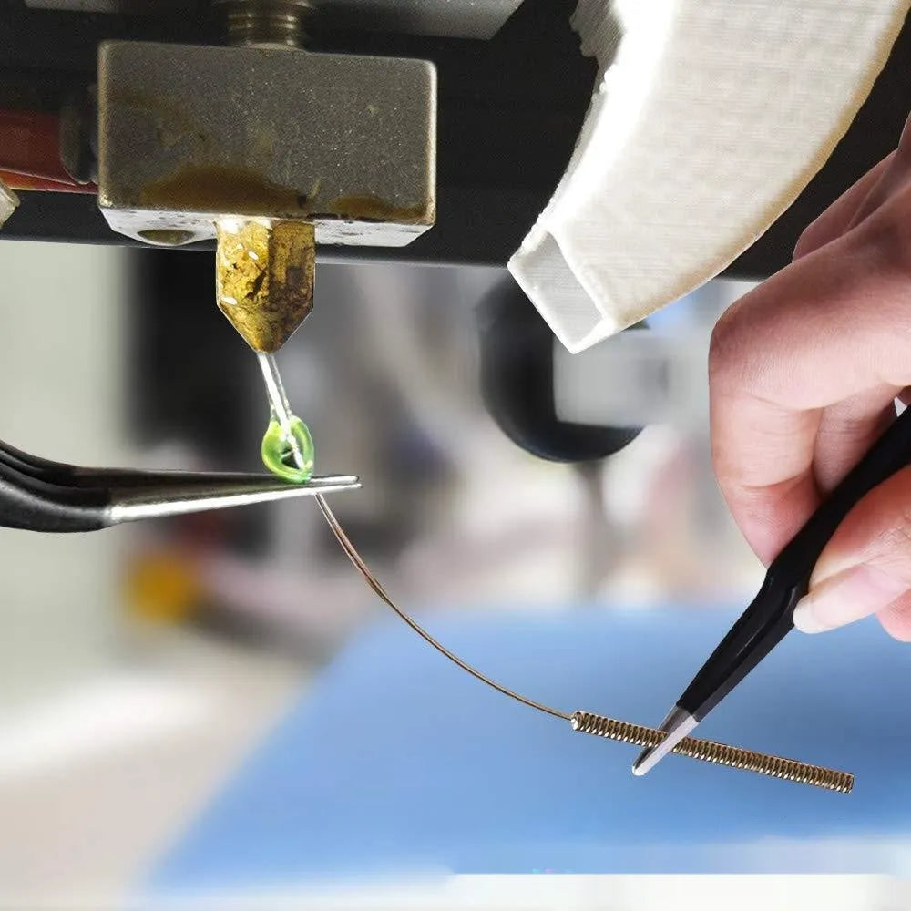 MK8 brass 3D printer nozzle with 0.4mm aperture and stainless steel cleaning pin on white background