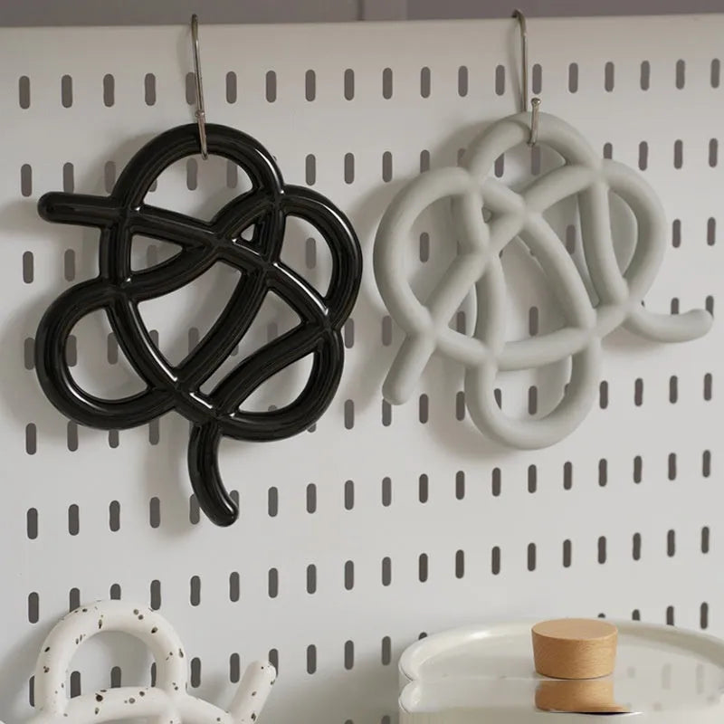 Ceramic heat proof mat in irregular shape for table protection in solid colours