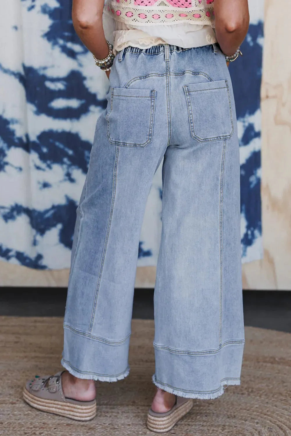 Beau blue wide-leg denim trousers with drawstring waist and raw hem detailing
