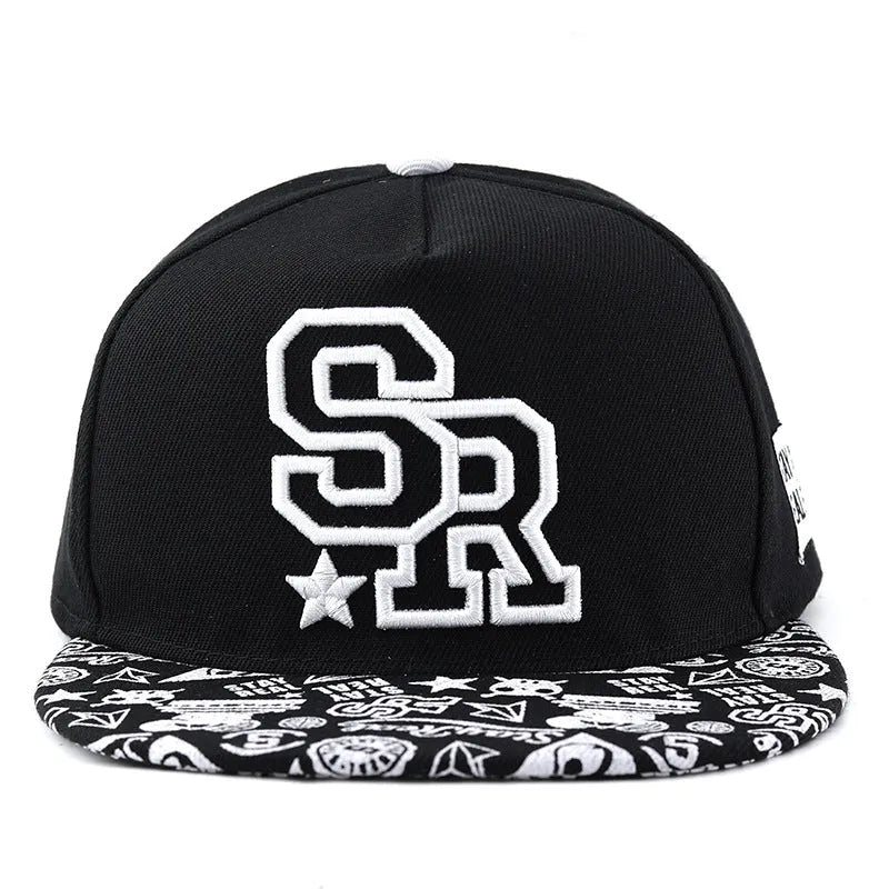 Cotton baseball hat with front letter embroidery in black colour, showing adjustable strap and dome crown.