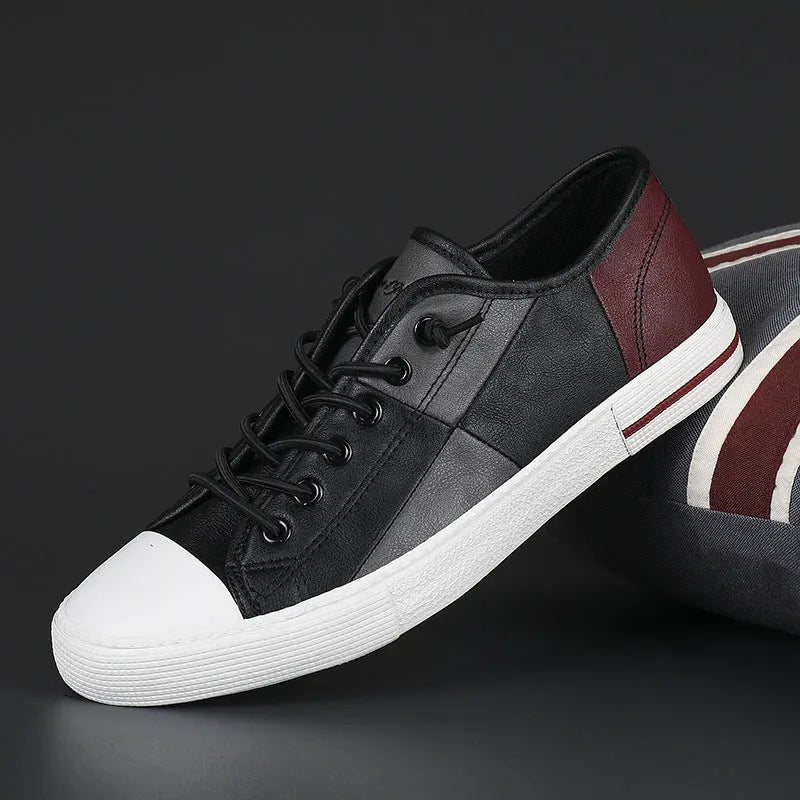 Men's leather shoes with elastic band fastening in black and white colour combination with rubber soles