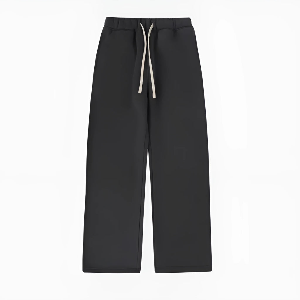 Men's black loose-fit fleece-lined sweatpants with an elastic drawstring waistband laid flat.