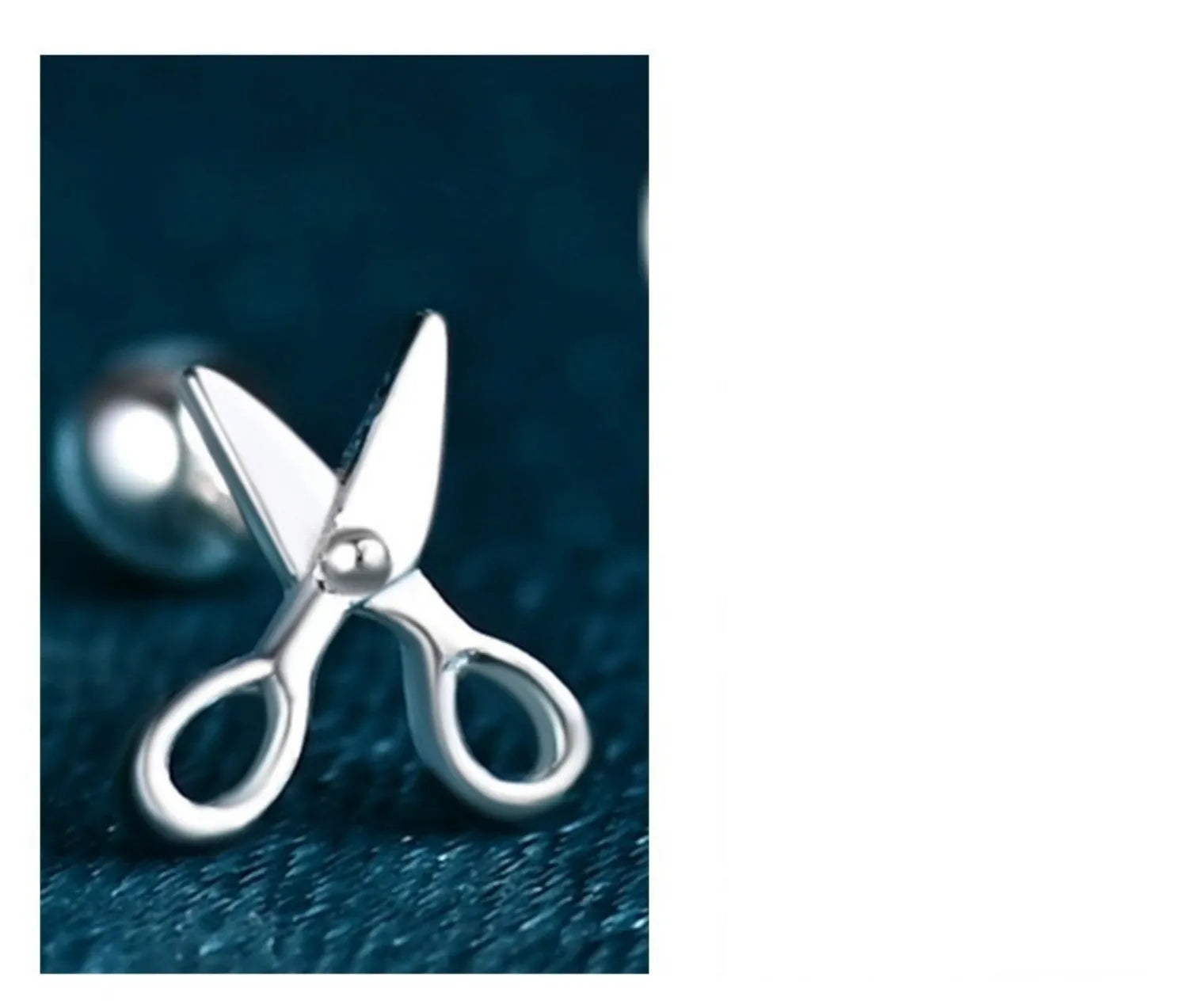 A pair of pure silver screw-style ear nails featuring a miniature scissors charm.