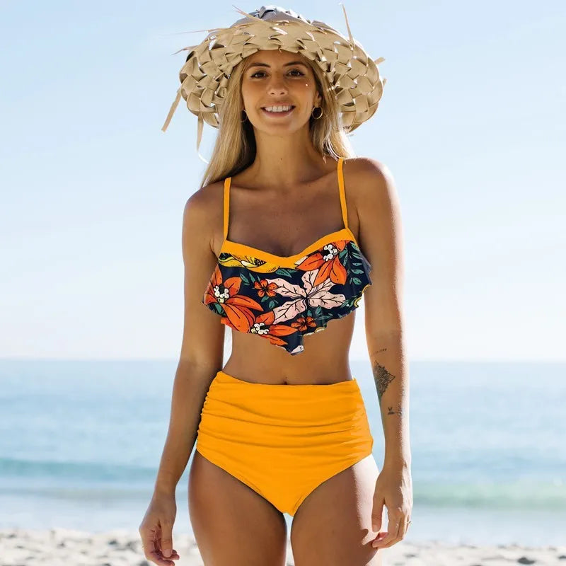 Women's blue and green floral patterned swimsuit with pleated pants and high waist design