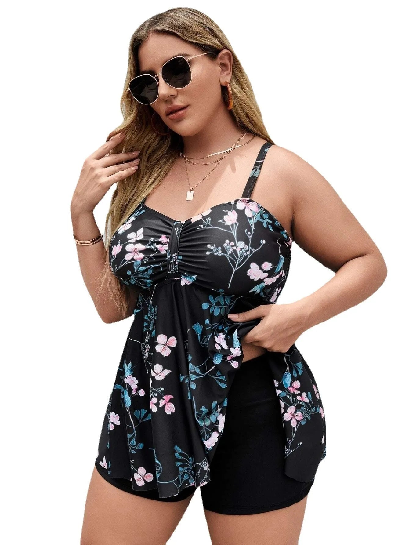 Women's floral print one-piece swimsuit on a hanger, showing split colour design and stretchy polyester fabric for plus sizes.