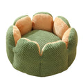 Green cactus-shaped enclosed pet kennel with soft plush interior, shown on a hardwood floor.