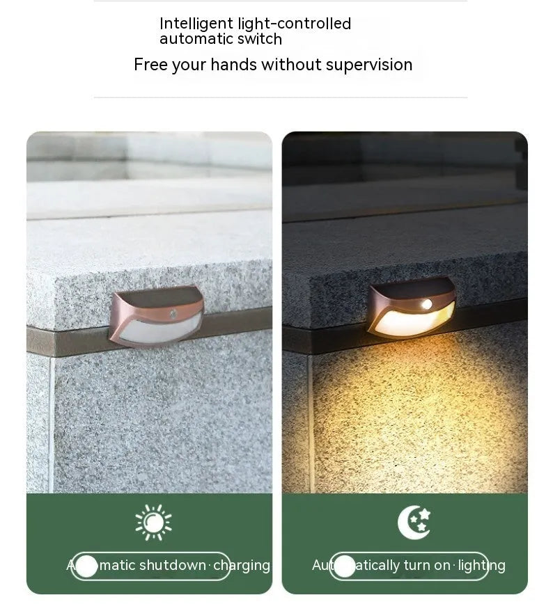 Solar-powered decorative wall lamp with smiling face design for outdoor garden lighting
