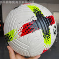 Fluorescent green Size 5 PU football with seamless thermal adhesive patch construction on grass.