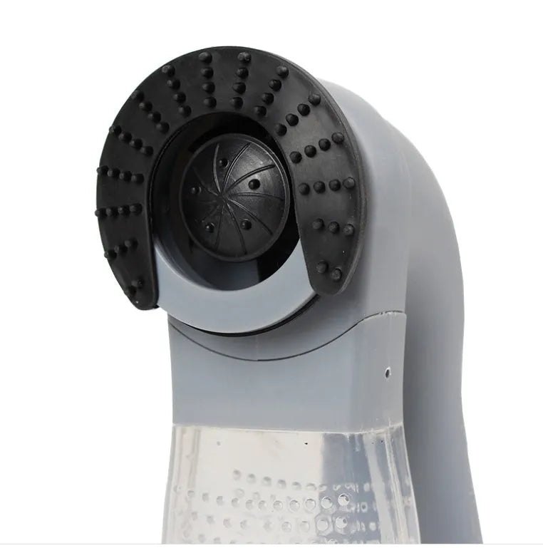 Grey handheld pet hair vacuum cleaner with soft rubber brush head for grooming dogs and cats.