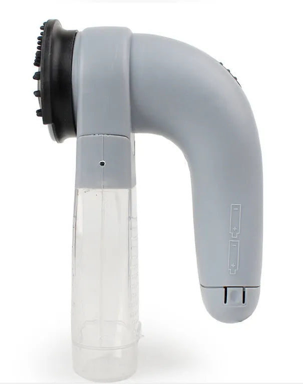 Grey handheld pet hair vacuum cleaner with soft rubber brush head for grooming dogs and cats.