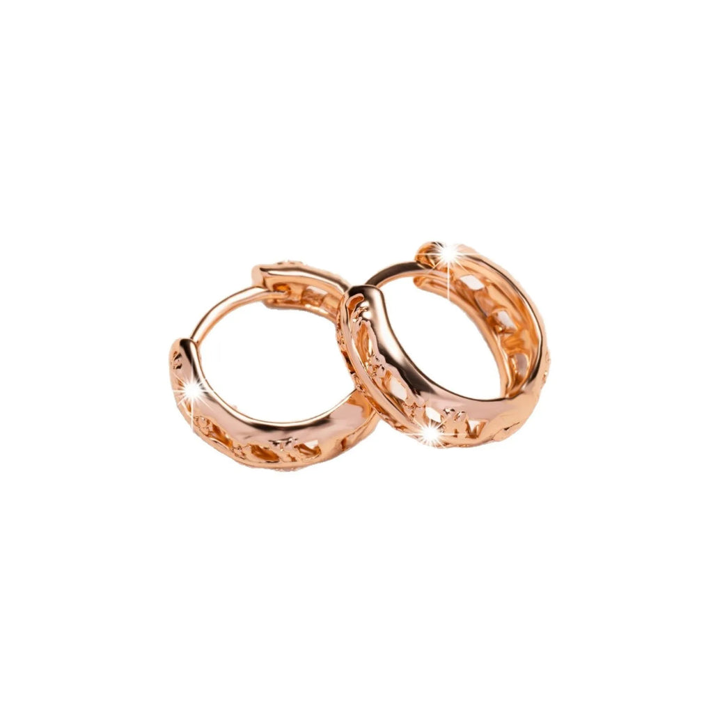 Rose gold finished leaf-shaped hollowed-out earrings with heart detail on copper base