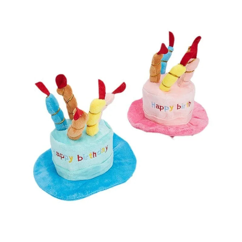 Blue and pink birthday hats for toy dogs on a festive background.