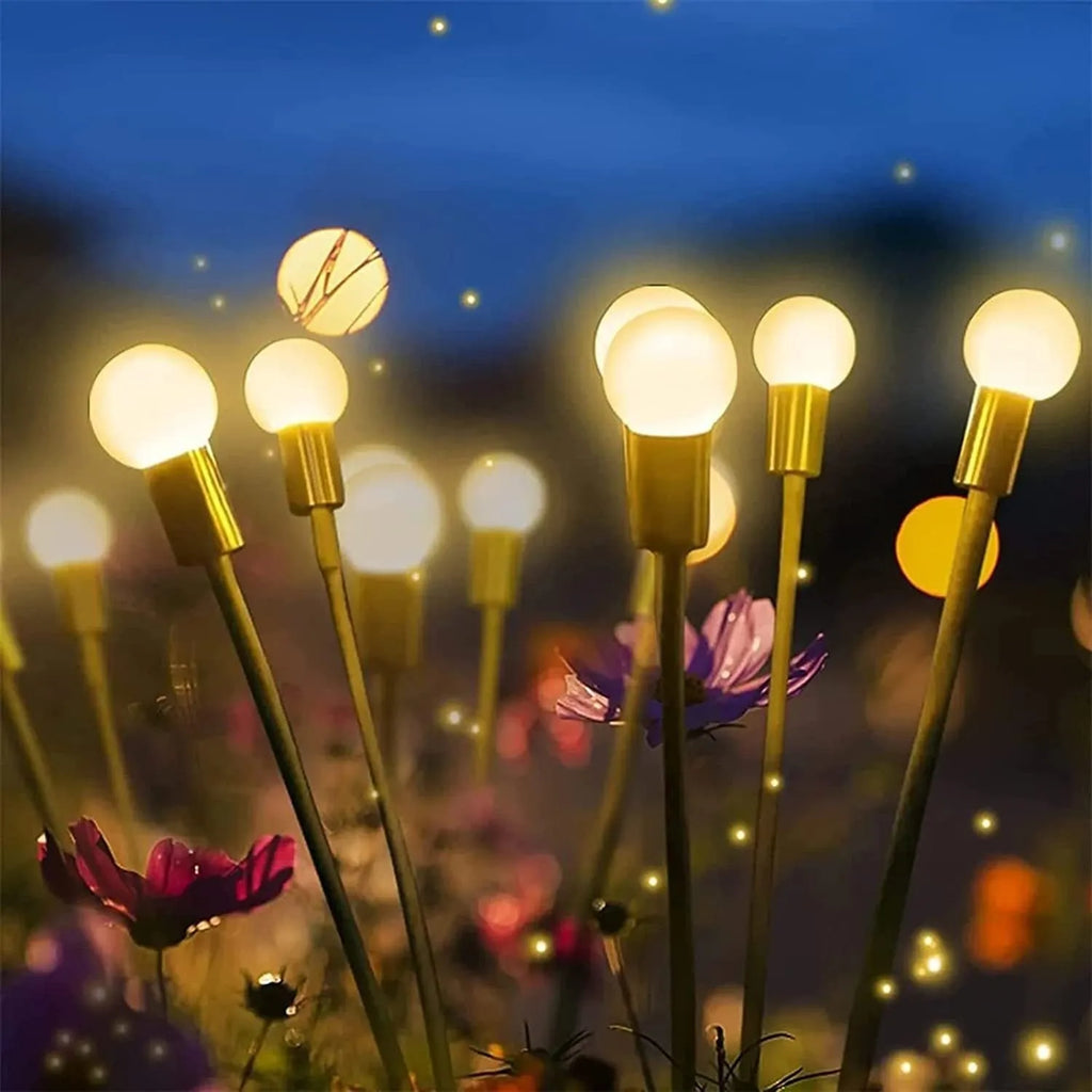 Solar-powered LED garden ground light with multiple LED heads and a stainless steel ground spike.